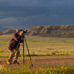 photographer with camera and tripod
