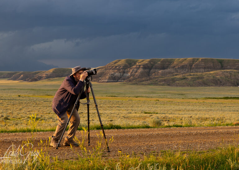 photographer with camera and tripod