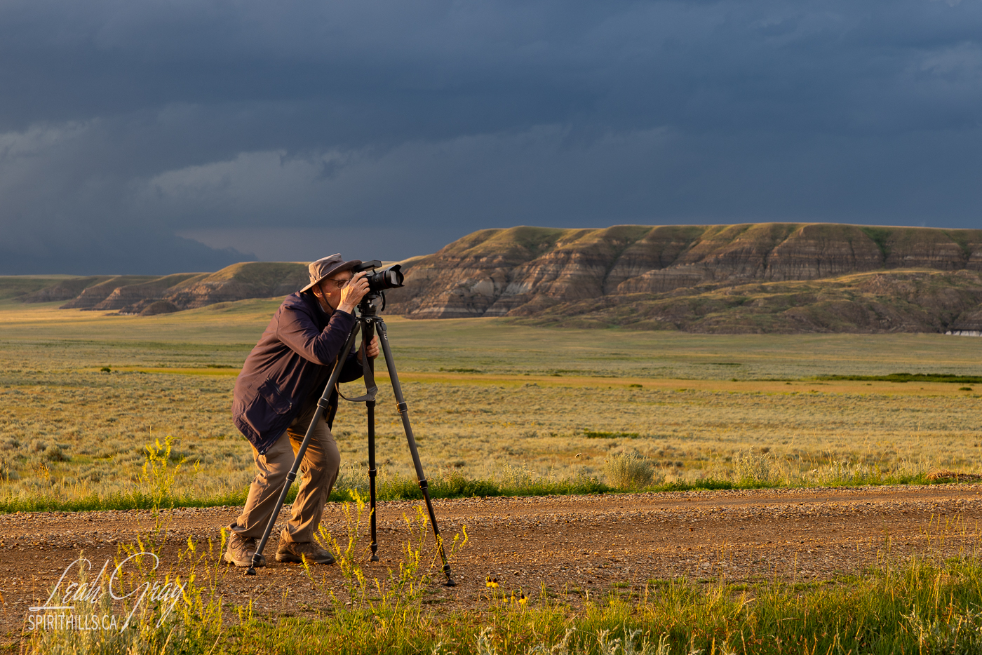 photographer with camera and tripod